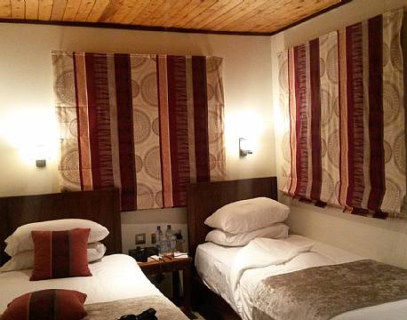 Små hyggelige værelser på trætophotellet The Ark